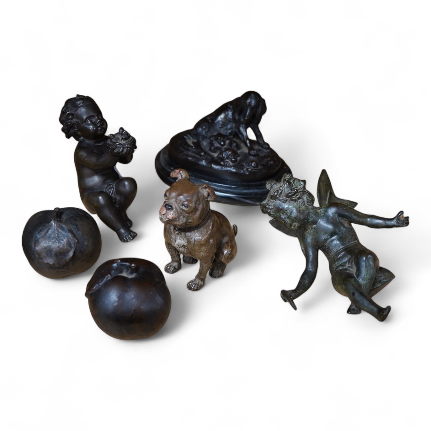 A small bronze of a of a hound and puppies after Louis Theophile Hingre (1832-1911), on marble base- 14.5cm wide, a painted bulldog ink stand, a putti and a fairy and two models of apples. (6).